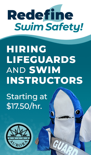 shark mascot letting people know the city is hiring lifeguards