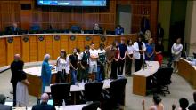 Group of people in the Aurora Council Chamber that links to the City Council meeting of July 22 2024