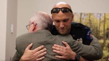 APD officer hugs man he helped save