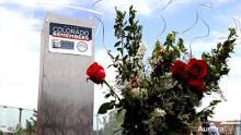 Roses in front of podium at Colorado Remembers event